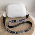 White faux leather crossbody camera bag with gold logo and wide patterned strap - Gold Stamping White