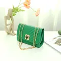 Green leather crossbody bag with V-quilted pattern and golden clover clasp closure - V-pattern Green