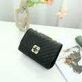 Elegant black V-quilted shoulder bag with a gold metal chain and a flower-shaped lock - V-Pattern Black