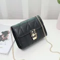 Classic black quilted crossbody bag with golden chain strap and twist-lock closure - Black