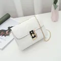 Classic white quilted crossbody bag with golden chain strap and square metal lock - White