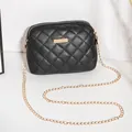 Quilted black crossbody bag with gold chain strap and elegant rhombus pattern - Black