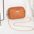 Brown quilted crossbody bag with gold chain strap and square metal plate detail - Tan