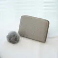 Gray woven leather zip wallet with matching plush pompom keychain and grid texture - Gray