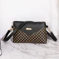 Retro black crossbody bag with golden circle pattern and rectangular metal buckle - Black