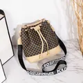 Brown patterned bucket bag with beige leather trim and a wide woven shoulder strap - Apricot