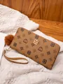 Brown long wallet with vintage geometric patterns and fluffy pompom charm detail - Brown