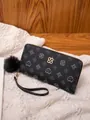 Women's long black zipper wallet with geometric patterns and a soft fur ball charm - Black