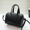 Classic black quilted Boston bag with gold hardware and detachable shoulder strap - Black
