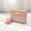 Pink patchwork women's short wallet with floral quilting, gold zipper and fuzzy pompom charm - Pink