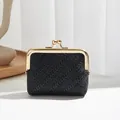 Vintage woven mini coin purse in black with gold kiss-lock metal frame and textured surface - Black