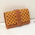 Contrast color women's wallet in dark brown and yellow with clover pattern detail - Brown