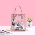Pink transparent crossbody bag with daisy prints and a gold chain strap - Pink