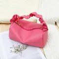 Pink lychee textured crossbody pillow bag with ruched cloud handle and gold zipper detail - Rose Red