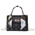 Black Kelly style handbag with floral print, scarf handle and gold chain strap - Black