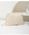 Detailed view of large white sequins and gold chain strap on a shimmering crossbody bag - White