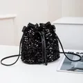 Fashionable black sequin drawstring bucket bag with leather strap and glossy finish - Black