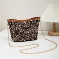 Fashionable bucket bag featuring sparkling gold and black sequins and chain strap - Black Brown