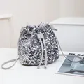 Sparkly silver sequin bucket bag with drawstring closure and slim shoulder strap - Silver