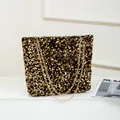Minimalist tote bag featuring black and gold sequins and a shiny gold chain strap - Black & Gold