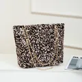 Sparkly black and gold sequin tote bag with elegant gold chain shoulder straps - Black Light Gold