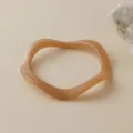Detailed close-up of vintage acrylic wavy bangle with marble texture and soft beige finish - Light Coffee Marble Wave Style (AB0026-2)