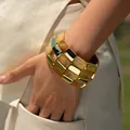 Close-up of a wide chunky bracelet featuring gold metal and beige marble resin blocks - Amber Texture Double-Row Style (AB0034-6)