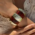 Detail of bohemian gold metal segments and amber resin modules on elastic wide bracelet - Amber Stripe Splicing Style (AB0033-6)