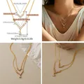 Double-layered V-shaped gold necklace with zircon stones and pear-shaped pendant - Double V Drop Zirconia Double Layer Style (KN0545) / 18K Gold