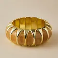 Chunky gold metal bracelet featuring amber textured resin panels in a minimalist design - Gold Amber Curved Panel Style (AB0039-3)