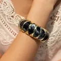 Chunky gold-tone bangle featuring elegant black and white marble resin bead inserts - Black White Marble Curved Partition (AB0039-5)
