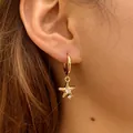 Golden starfish hoop earrings with white zircon accents for a casual beach style look - Starfish With Zirconia Accents (KE1781)