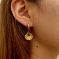 Golden shell hoop earrings with green zircon pendant for a beach vacation style look - Shell With Green Stone Style (KE1784-2)