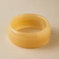 Translucent amber yellow acrylic wide bangle with a smooth polished round finish - Light Yellow Bangle (AB0042-1)
