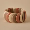 Close-up of chunky stretch bracelet with earth-toned resin segments in a minimalist style - Crescent Color Block Patchwork Style (AB0069-5)