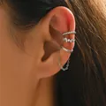 Close-up of three silver ear cuffs with crystals and long chain on model ear - Silver Ear Cuffs Triple (EH5450-2)