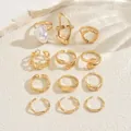 Detailed set of twelve gold-plated geometric rings featuring a large white baroque pearl - Bohemian Artificial Pearl Ring 12-Piece Set (JZ1463) / Gold