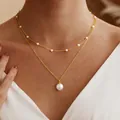 Detail of double-layered gold chain necklace featuring delicate pearls worn by a model - Double Layer Layered Pearl Necklace (AM80017)