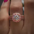 Luxurious rose gold halo ring with round central zircon and pavé band worn on finger - US 5 / Rose Gold