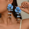 Close-up of elegant light blue chiffon floral drop earrings worn by a model - Sky Blue (EH5557-6)