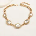 Luxurious gold chunky curb chain necklace featuring five large oval crystal pendants - Gold Oval Artificial Gemstone Style (XL4784B)
