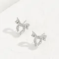 Close-up of silver bow earrings with 18K plating and polished polka dot texture - Silver Dainty Bow (BSSP007B)