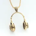 Detailed close-up of antique gold headphone pendant with intricate diamond textures - Charm / Gold / Pendant Only (Without Chain)