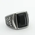 Macro shot of retro men's steel ring with square black stone and leaf carvings - Size 7 / Silver Black