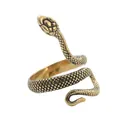 Close-up of golden stainless steel snake ring showing detailed scales and punk texture - US 7 / Vintage Gold