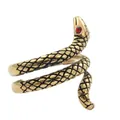 Macro shot of gold snake ring with detailed scale texture and striking red stone eyes - Size 7 / Vintage Gold with Red Eyes