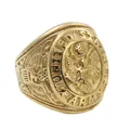 Macro shot of gold United States Army ring with detailed eagle emblem and side engraving - US 7 / Gold