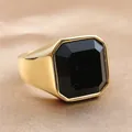 Macro shot of a vintage gold ring featuring a large octagonal cut black gemstone - Size 7 / Polished Gold Black Gemstone Style