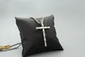 Detail of silver cross pendant with poker suit engravings on black leather cushion - Bamboo Cross (Box Chain) / Fashion Silver