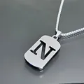 Collier avec pendentif lettre N ajourée en acier inoxydable argenté poli pour unisexe - Style Lettre N